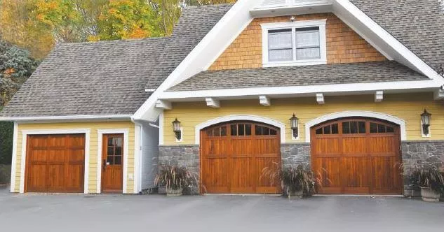 House with wood garage doors
